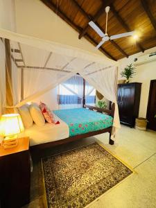 Postel nebo postele na pokoji v ubytování Onadi House