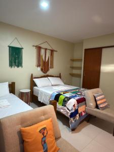 Postel nebo postele na pokoji v ubytování Quintal da Espera - Praia de Itacimirim