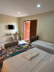 Postel nebo postele na pokoji v ubytování Quintal da Espera - Praia de Itacimirim