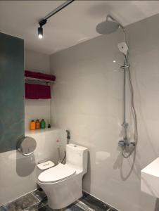 a bathroom with a toilet and a shower at Cozy Home for Family, Friends & Work Trips in Buon Ma Thuot +30 photos