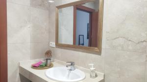 a bathroom with a sink and a mirror at Divina 10 in Avilés +36 photos
