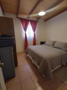 Postel nebo postele na pokoji v ubytování Cabañas La Marca