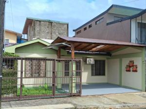 a house with a gate in front of it at Casa Abril - La Fortuna in Fortuna
