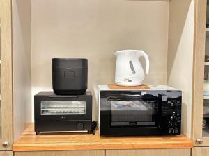 Fotografie z fotogalerie ubytování Mid Century Modern Kawaramachi Apt v destinaci Takamacu