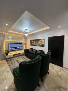 TV a/nebo společenská místnost v ubytování Aureum Residence Anthony Lagos