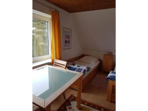 a small bedroom with a bed and a window at Holiday home in Balje with Wi-Fi in Balje