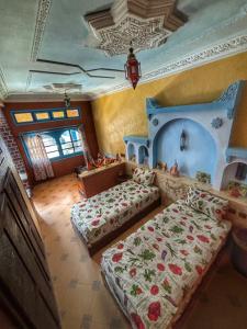 Ένα ή περισσότερα κρεβάτια σε δωμάτιο στο Taddart Aglou