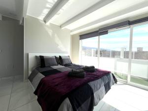 Giường trong phòng chung tại Ático Dio Vista tipo Dúplex con terraza soleada