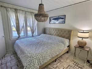 Ένα ή περισσότερα κρεβάτια σε δωμάτιο στο St Augustine Island, King Bed, Beach Living