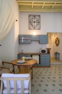 a kitchen with a table and chairs in a room at Casa Elisa in Marbella +10 photos
