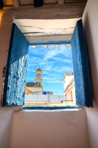 an open window with a view of a building at Casa Elisa in Marbella