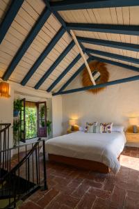 a bedroom with a large bed in a room at Casa Elisa in Marbella