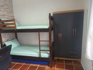 En eller flere senge i et værelse på Arco-íres do Sheyke