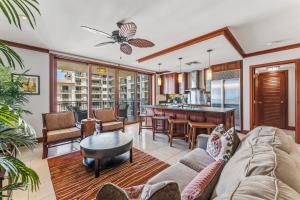 a living room with a couch and a table at Beach Villas at Ko Olina 8th floor Ocean View in Kapolei