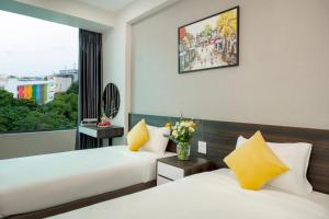 Ένα ή περισσότερα κρεβάτια σε δωμάτιο στο Ivy Luxury Hotel Ha Noi +71 φωτογραφίες