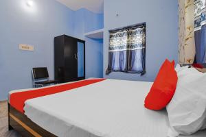 Postel nebo postele na pokoji v ubytování Hotel O Buddha Paradise