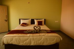 Ένα ή περισσότερα κρεβάτια σε δωμάτιο στο S N Greens