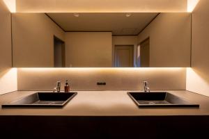 a bathroom with two sinks and a mirror at Amao Villa 自然郷 in Atami +68 photos