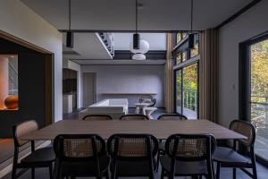 a dining room with a table and chairs at Amao Villa 自然郷 in Atami