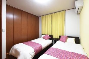 Postel nebo postele na pokoji v ubytování ORENCHi