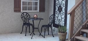 a table and chairs on a porch with a window at Villa Serena Tuscan Theme home with a HIDDEN lounge, fire pit, lawn games, creek in Dahlonega +73 photos