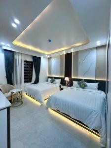 Postel nebo postele na pokoji v ubytování Six Brothers Boutique Hotel