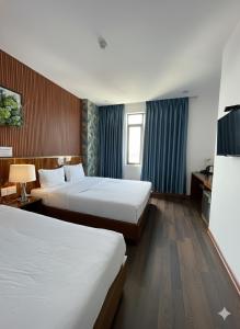 Ένα ή περισσότερα κρεβάτια σε δωμάτιο στο LamoreKhuespa&hotel