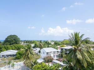 an aerial view of a resort with palm trees at Quicksand Rasdhoo in Rasdu