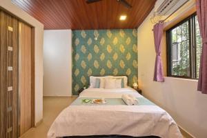 a bedroom with a large bed in a room at Lifeline Villas -Sunset Bird Infinity Pool Villa With Valley View in Panchgani