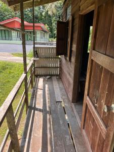 an open door of a wooden building with a porch at Balance home happy in Ko Yao Noi