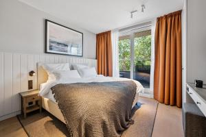 Postel nebo postele na pokoji v ubytování Alte Schule Westerhever Ehst