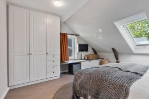 Postel nebo postele na pokoji v ubytování Alte Schule Westerhever Vollerwiek