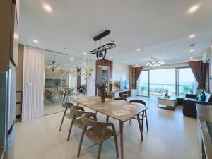 a dining room and living room with a table and chairs at THE SONG CĂN HỘ GẦN BÃI SAU THÁP TAM THẮNG - Po'sHomestay Luxury Bãi Sau in Vung Tau