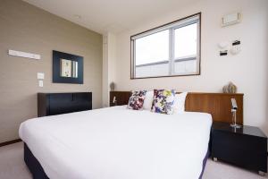 Postel nebo postele na pokoji v ubytování Toshokan #2