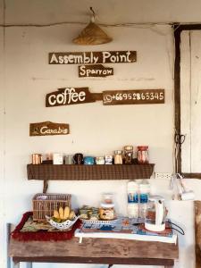 a coffee shop with signs on the wall at Sparrow Hut in Pai +42 photos
