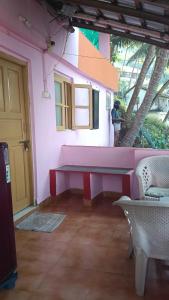 a person standing in a room with a pink wall at G naik part 2 in Arambol