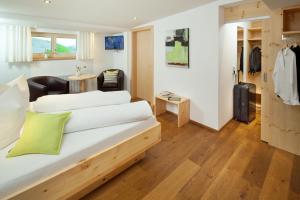 Postel nebo postele na pokoji v ubytování Aparthotel Brunnenhof + 28 fotografií