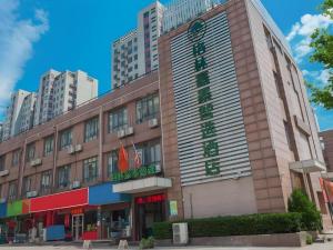 a building in a city with tall buildings at Green Tree Inn Express Hefei Yungu Road Linhu Community in Hefei