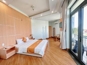 Ένα ή περισσότερα κρεβάτια σε δωμάτιο στο Thiên Trang 2 Hotel - Khách sạn gần bến tàu Rạch Giá