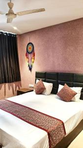 a bedroom with two beds in a room at Sunrise cave in Surat