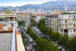 a view of a city street with buildings at Hôtel Monsigny in Nice