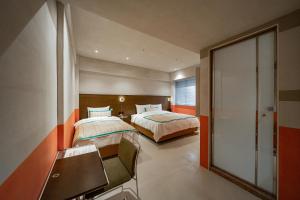 Postel nebo postele na pokoji v ubytování PAPO'A Labs