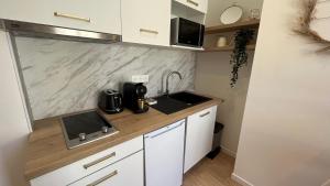 Kuchyň nebo kuchyňský kout v ubytování Le Nid Doré au calme + 7 fotografií