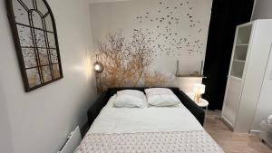 Postel nebo postele na pokoji v ubytování Le Nid Doré au calme