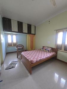 Ένα ή περισσότερα κρεβάτια σε δωμάτιο στο Rakesh's house
