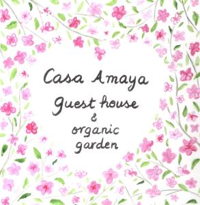 a wreath of pink flowers with the words casa amaya guest house at Hostal Casa Amaya in Vallehermoso