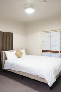 Ένα ή περισσότερα κρεβάτια σε δωμάτιο στο rice house