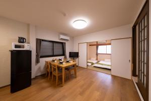 TV a/nebo společenská místnost v ubytování 青羽-橘山