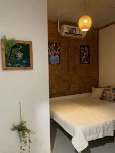 Ένα ή περισσότερα κρεβάτια σε δωμάτιο στο Homestay Mia Diệu Nhàn Phú Quốc +20 φωτογραφίες