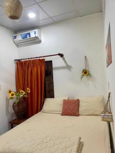 Ένα ή περισσότερα κρεβάτια σε δωμάτιο στο Homestay Mia Diệu Nhàn Phú Quốc